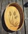 Vintage wall-mounted wicker and pyrographed wood bread basket