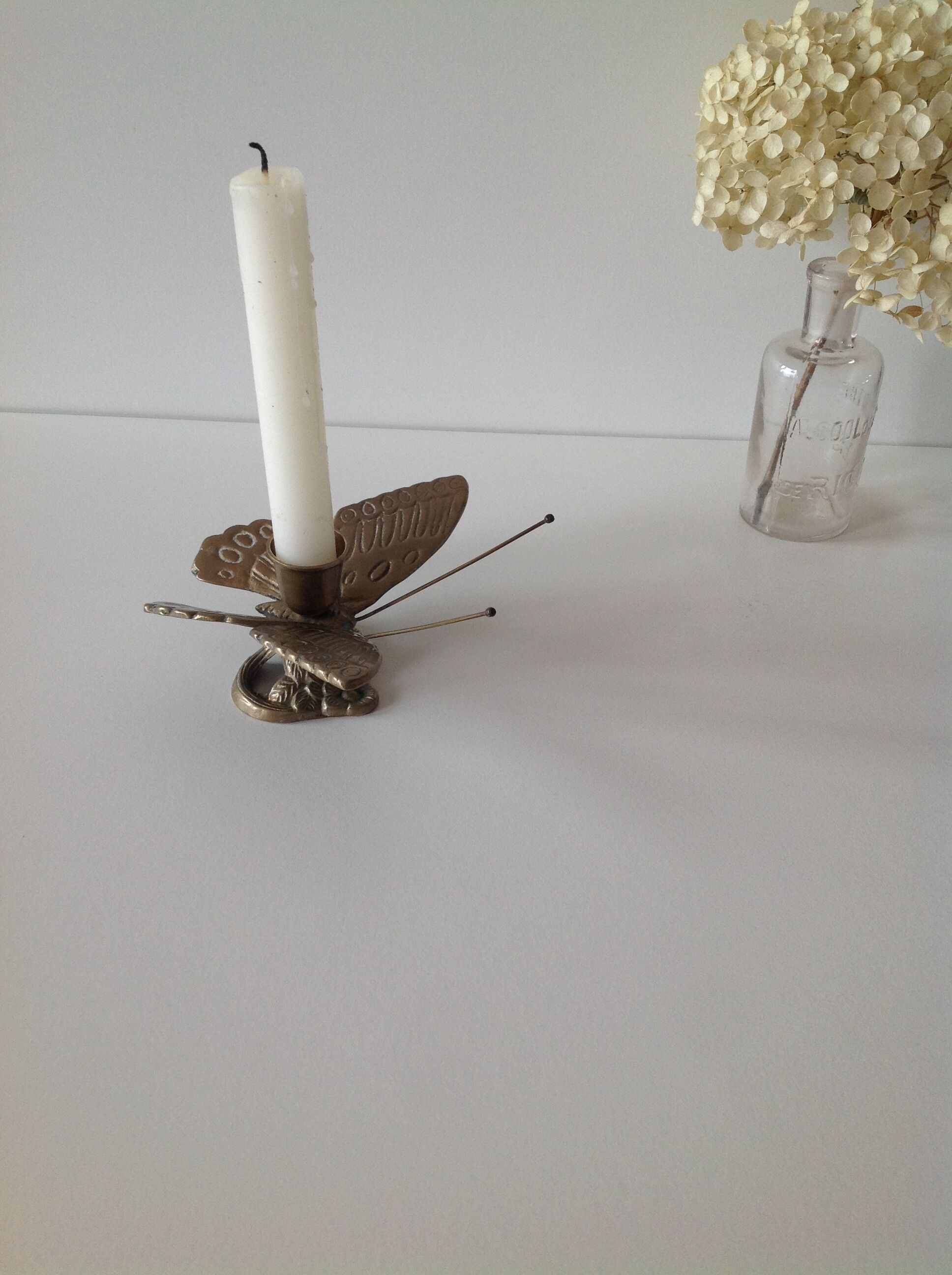 Brass butterfly candlestick