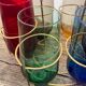 Crystal coloured water glasses in gilded metal glass holders 1970