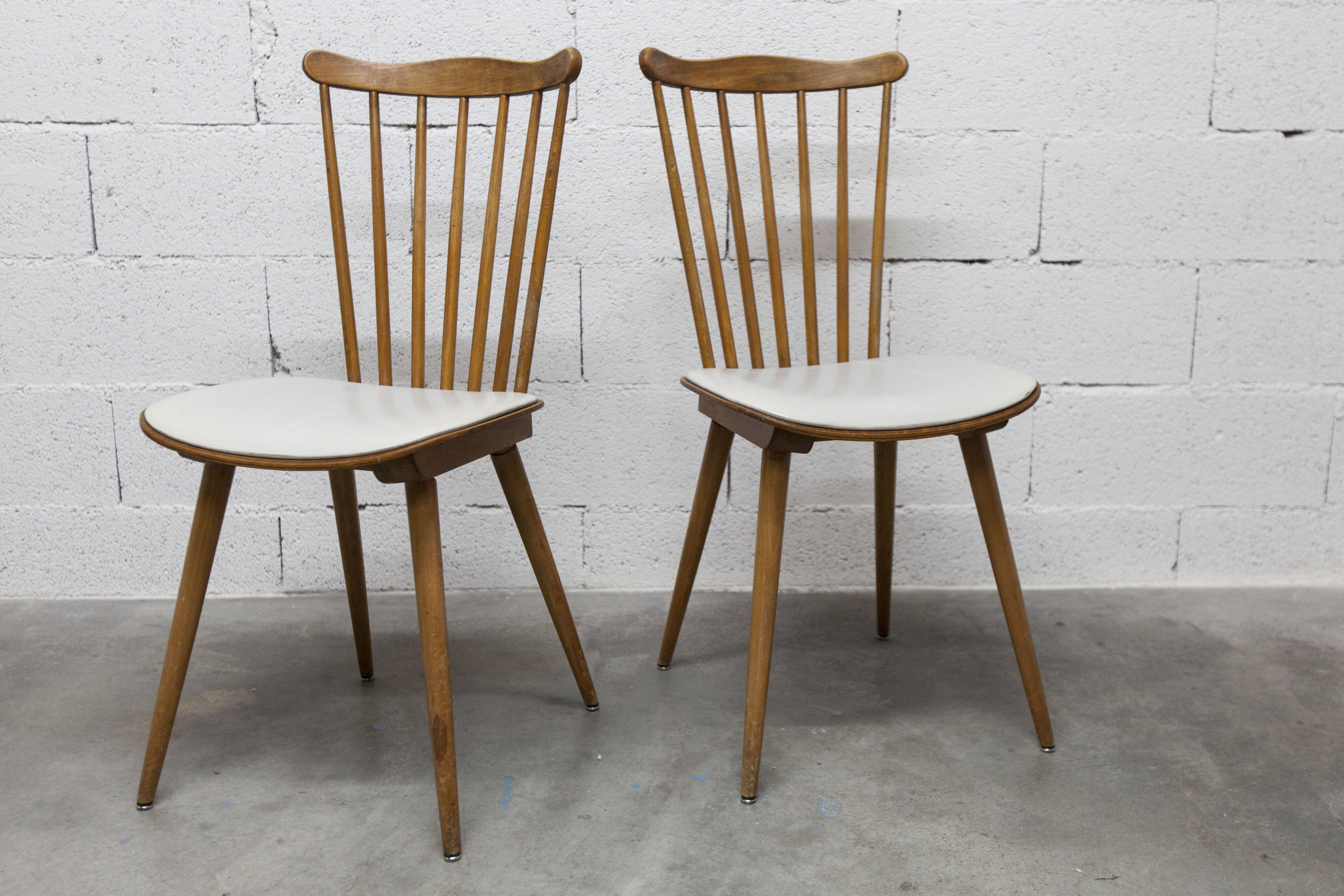 Pair of Baumann Menuet chairs, Honey patina, White vinyl seats