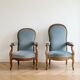 Pair of Louis XV reclining Voltaire armchairs in blue fabric.