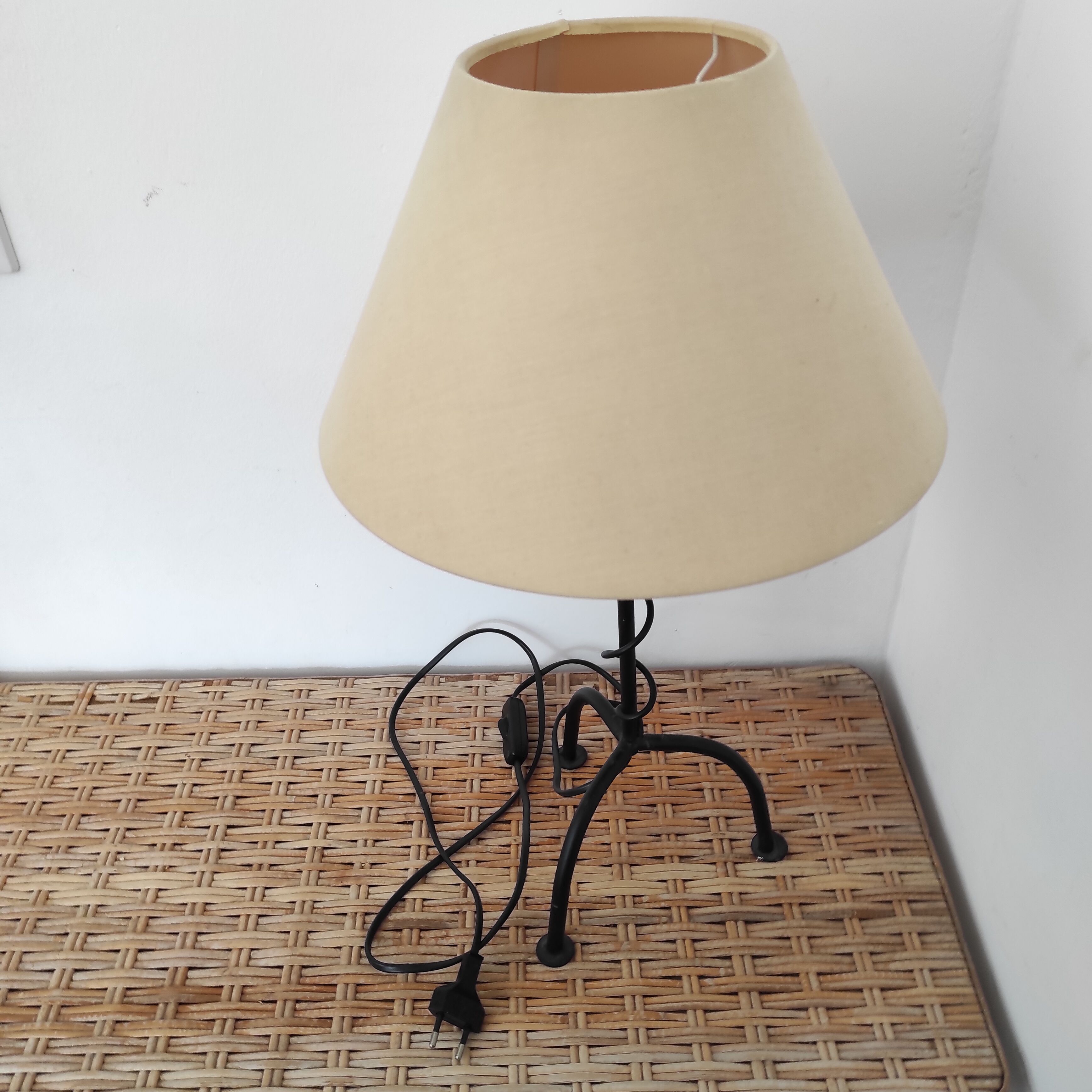 Black wrought iron table lamp and beige lampshade