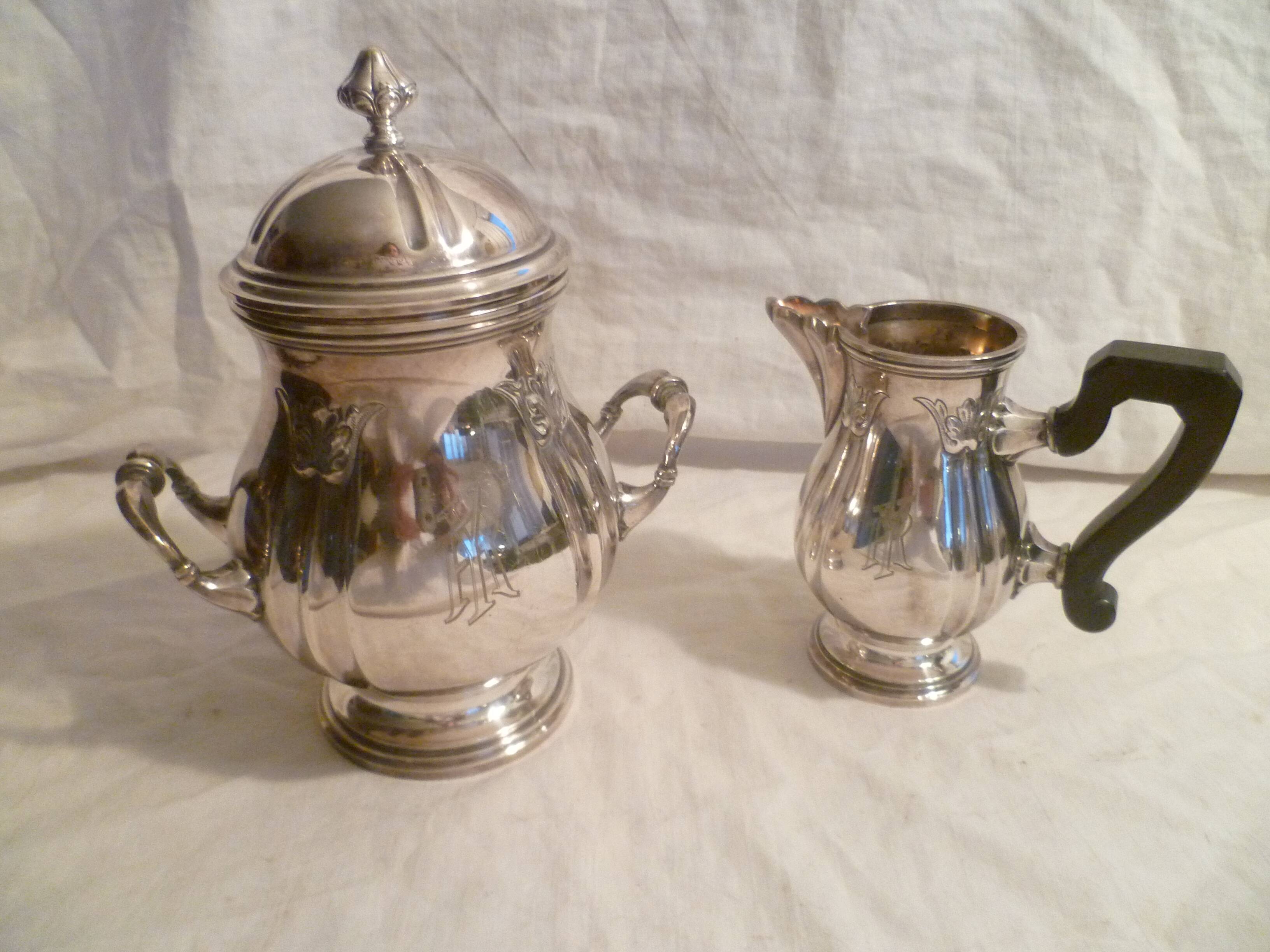 Sugar bowl & its milk pot with ebony handle in silver metal