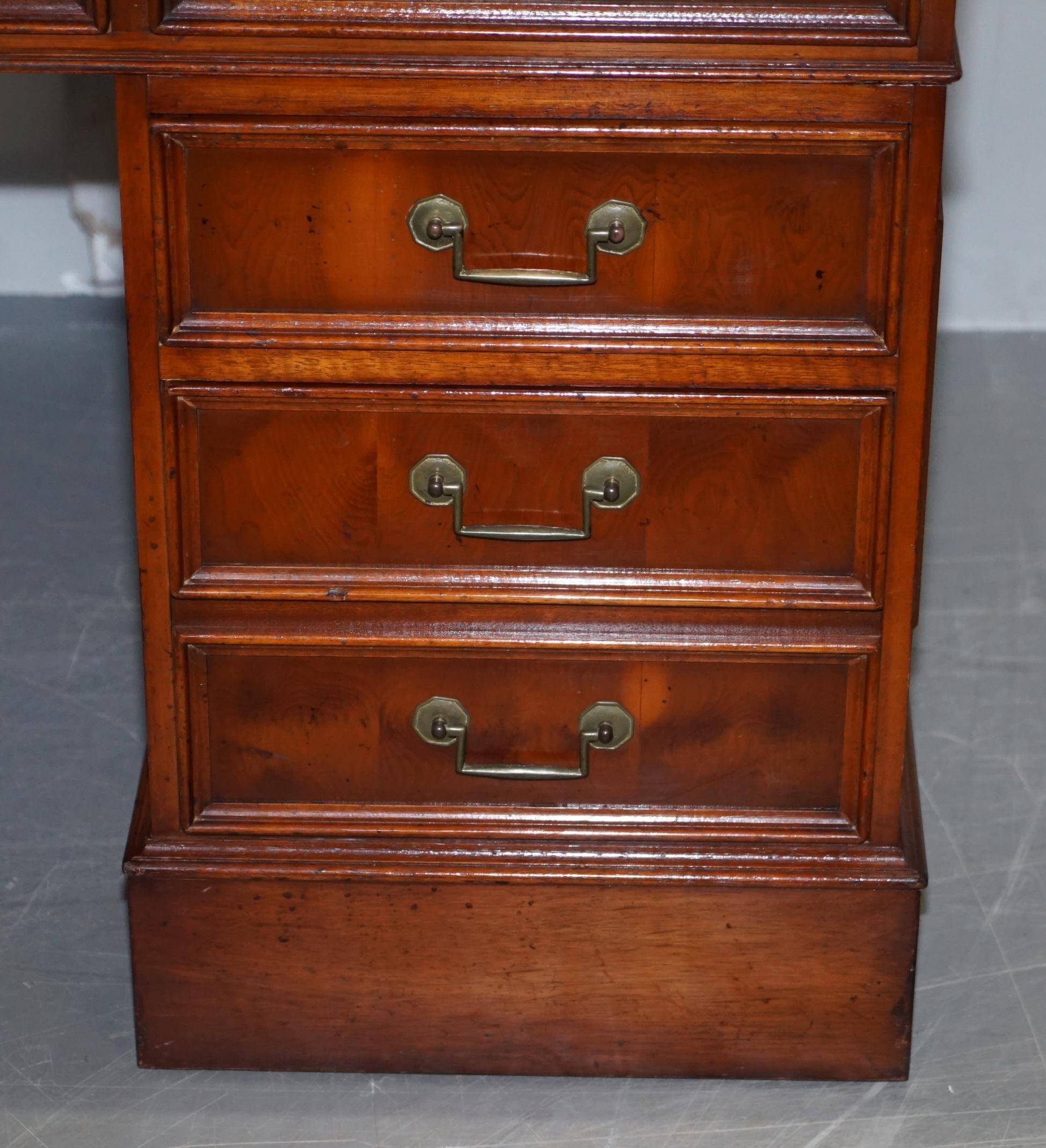 Partner desk with double pedestal in burr yew wood with decorated top.