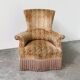 Pair of sculptural Hollywood Regency lounge chairs with original fringed upholstery