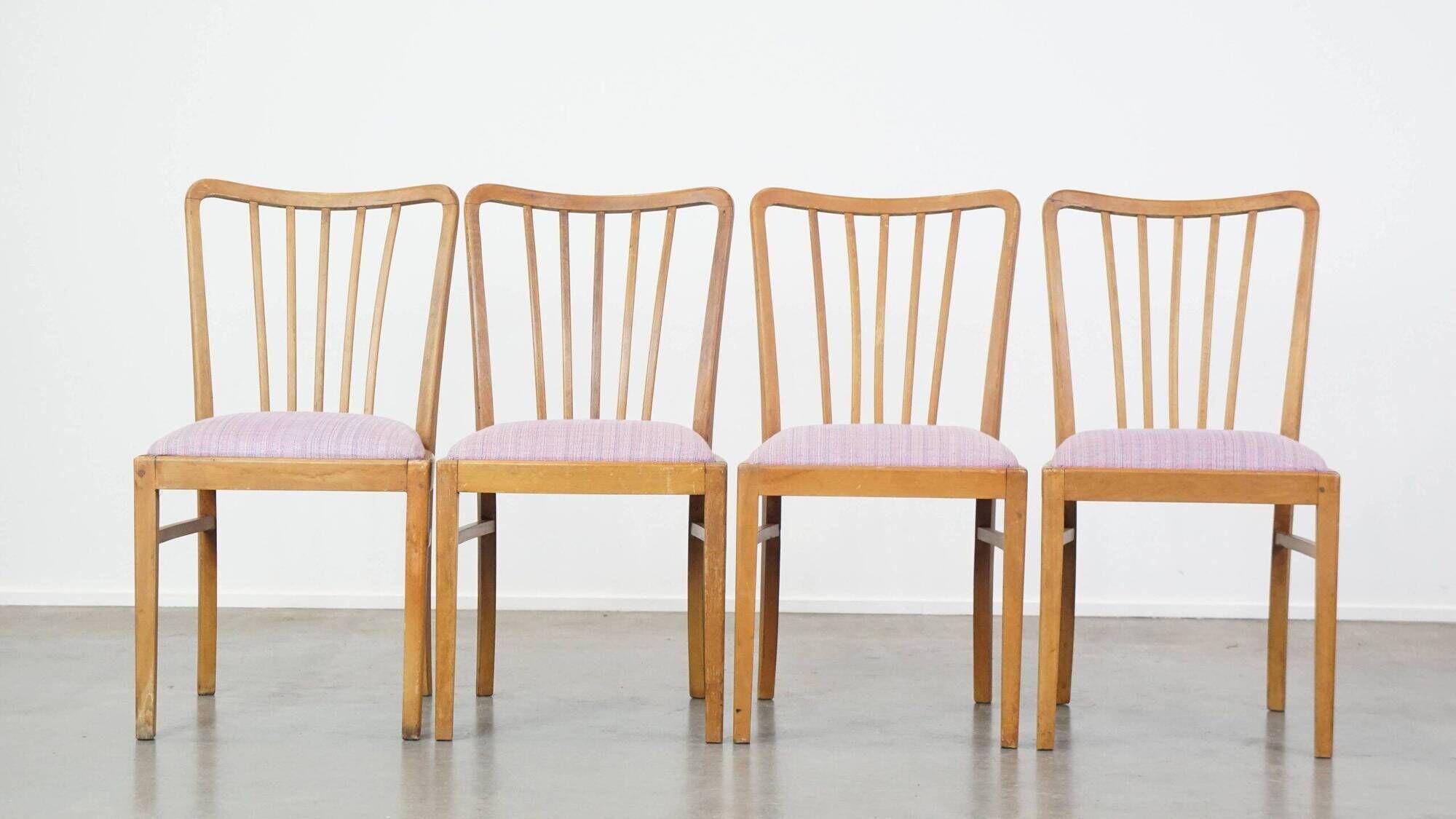 Set of four dining chairs from the 1970s with fabric seat and wooden frame