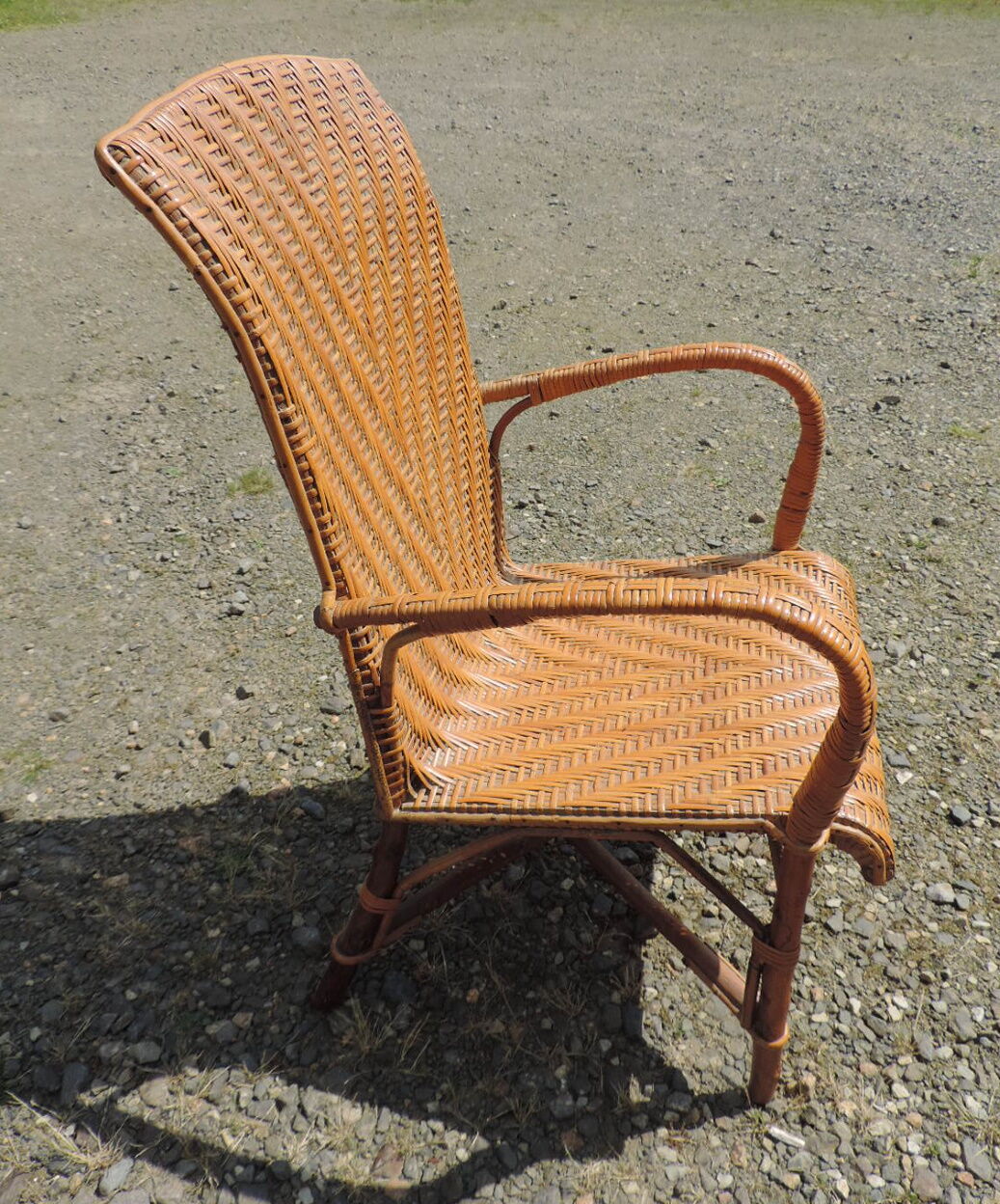 Rattan armchair with high backrest