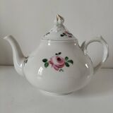 Porcelain teapot with rose patterns