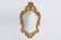 Miroir à crête à facettes de style rococo ou baroque français en bois sculpté doré