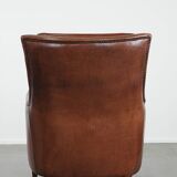 Cognac brown cow leather armchair with decorative nail finish