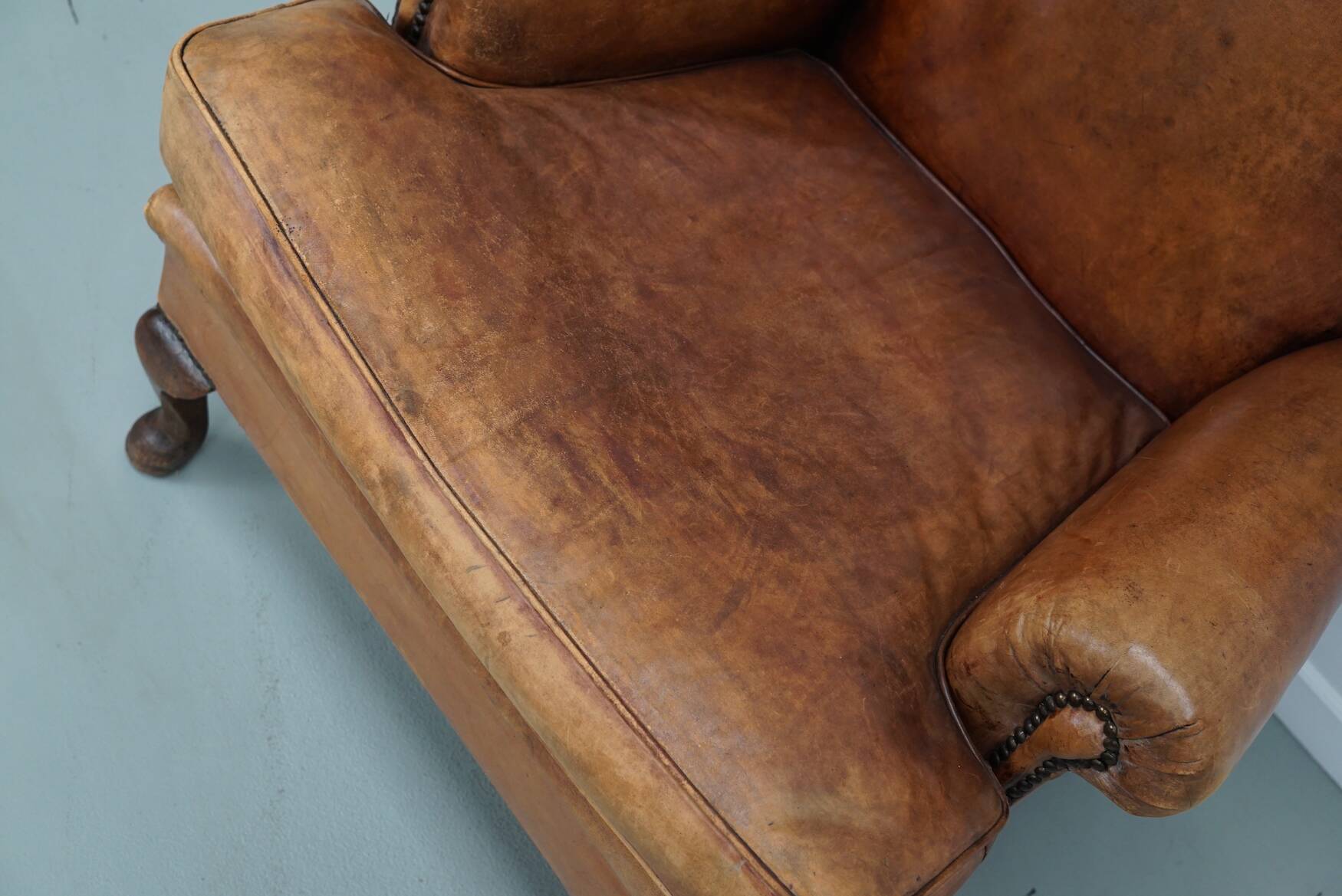 Vintage Dutch cognac coloured leather club chair, with footstool