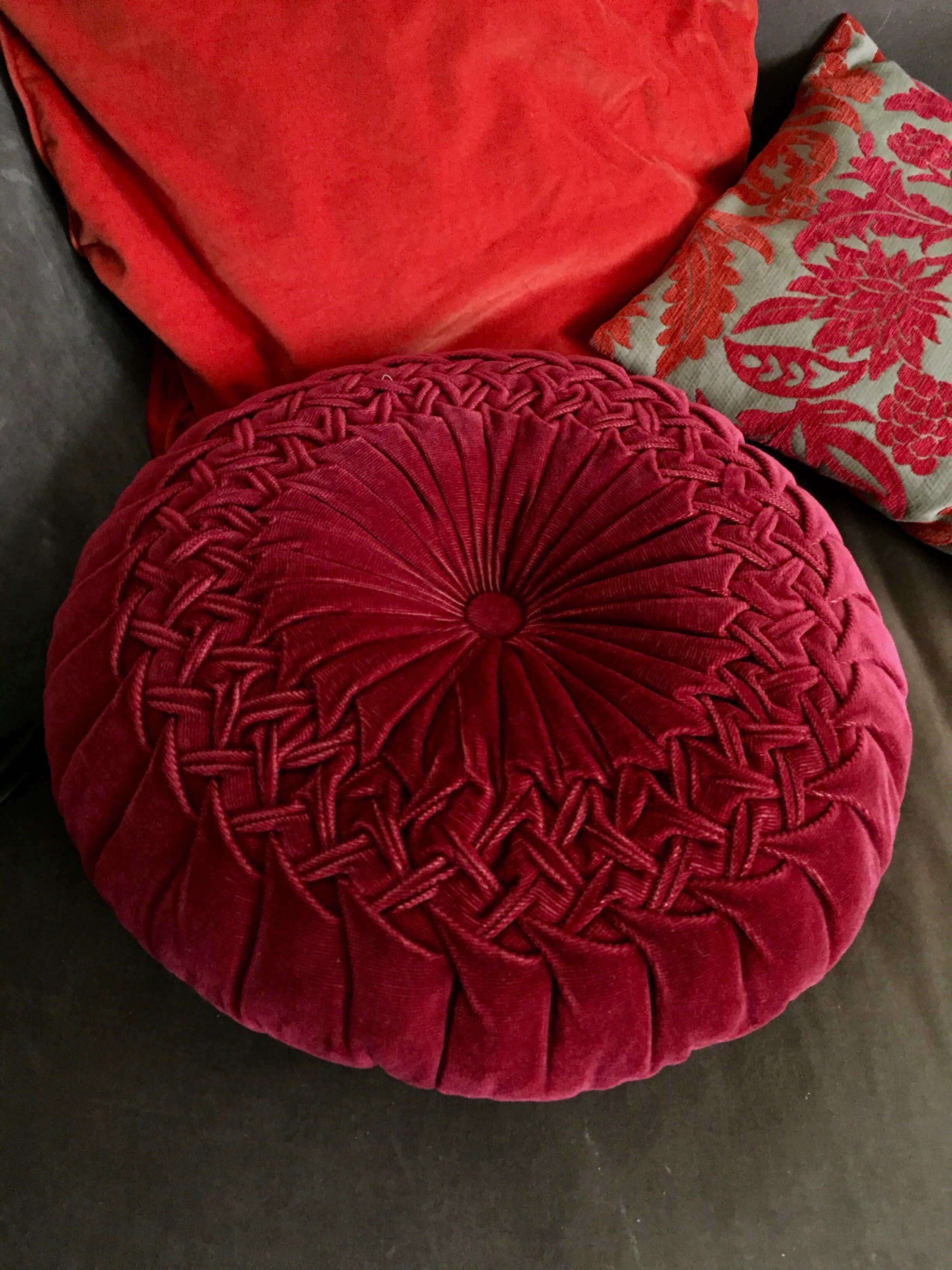 Red braided velvet cushion