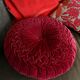 Red braided velvet cushion
