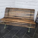 Old cast iron garden bench with oak slats