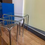 Nesting tables in chrome metal and white glass