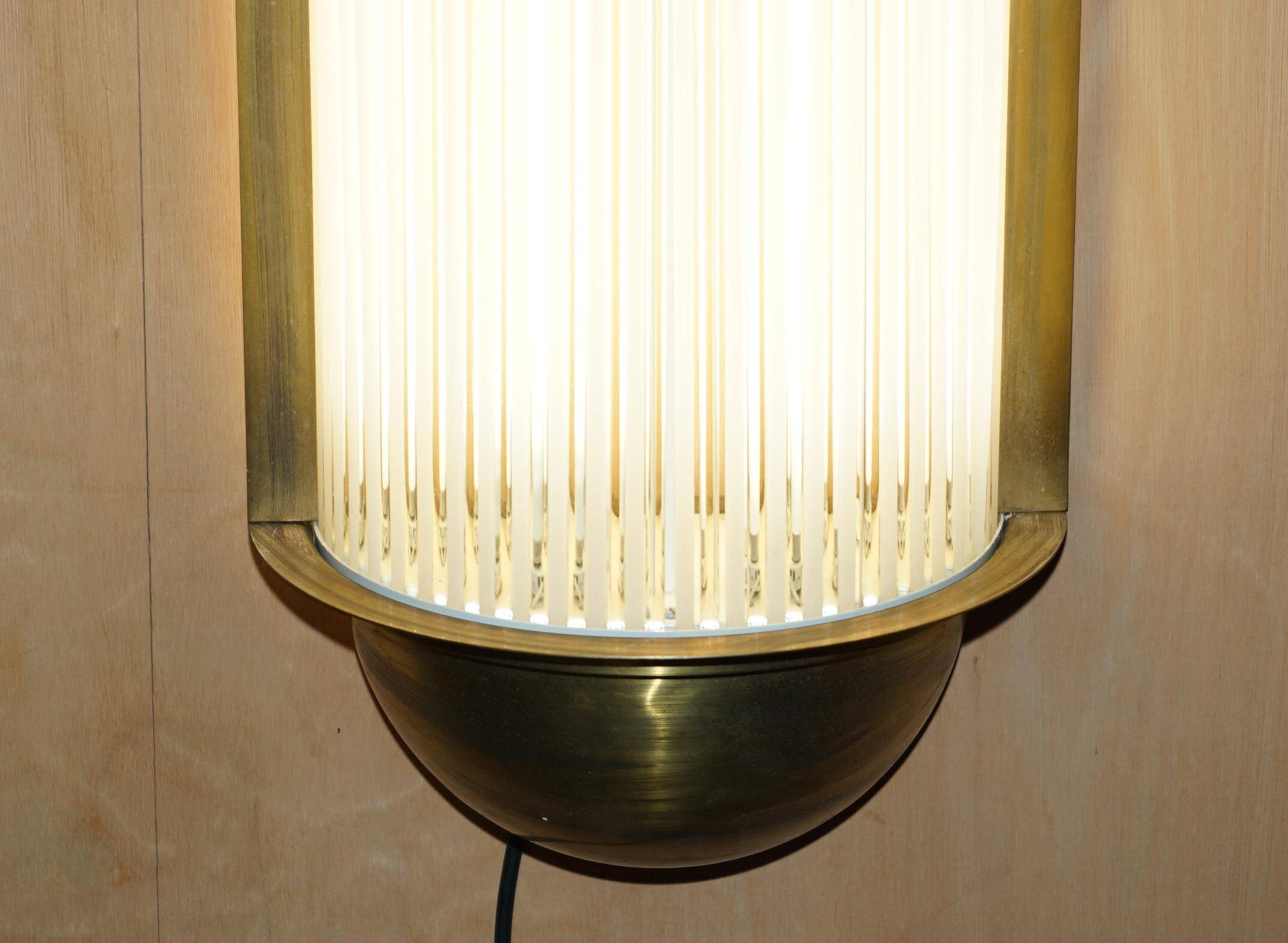 Pair of Art Deco wall sconces in brass and glass by Genet-Michon.