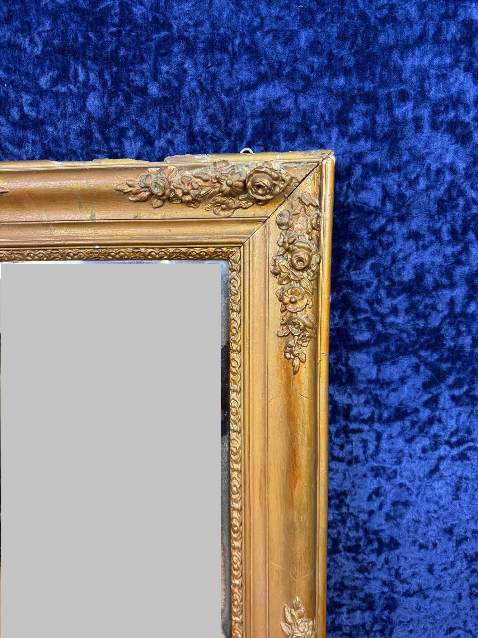 Empire period mirror in wood and gilded stucco circa 1810-1820