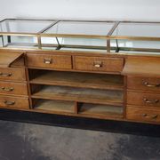 Counter or shop window in oak glass and brass France around 1920