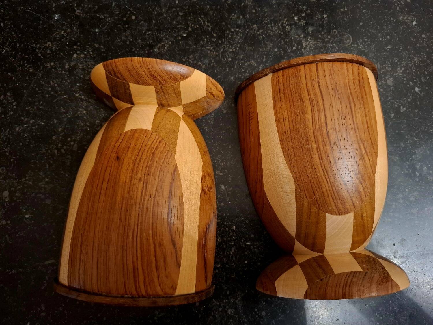 Bookends in exotic wood marquetry in the shape of a tambourine.
