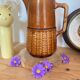 Antique vintage ceramic pitcher or jug from Sarreguemines, France. Brown with a pink interior, imitation basket.