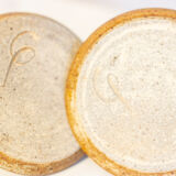 2 stoneware shells, unidentified signature