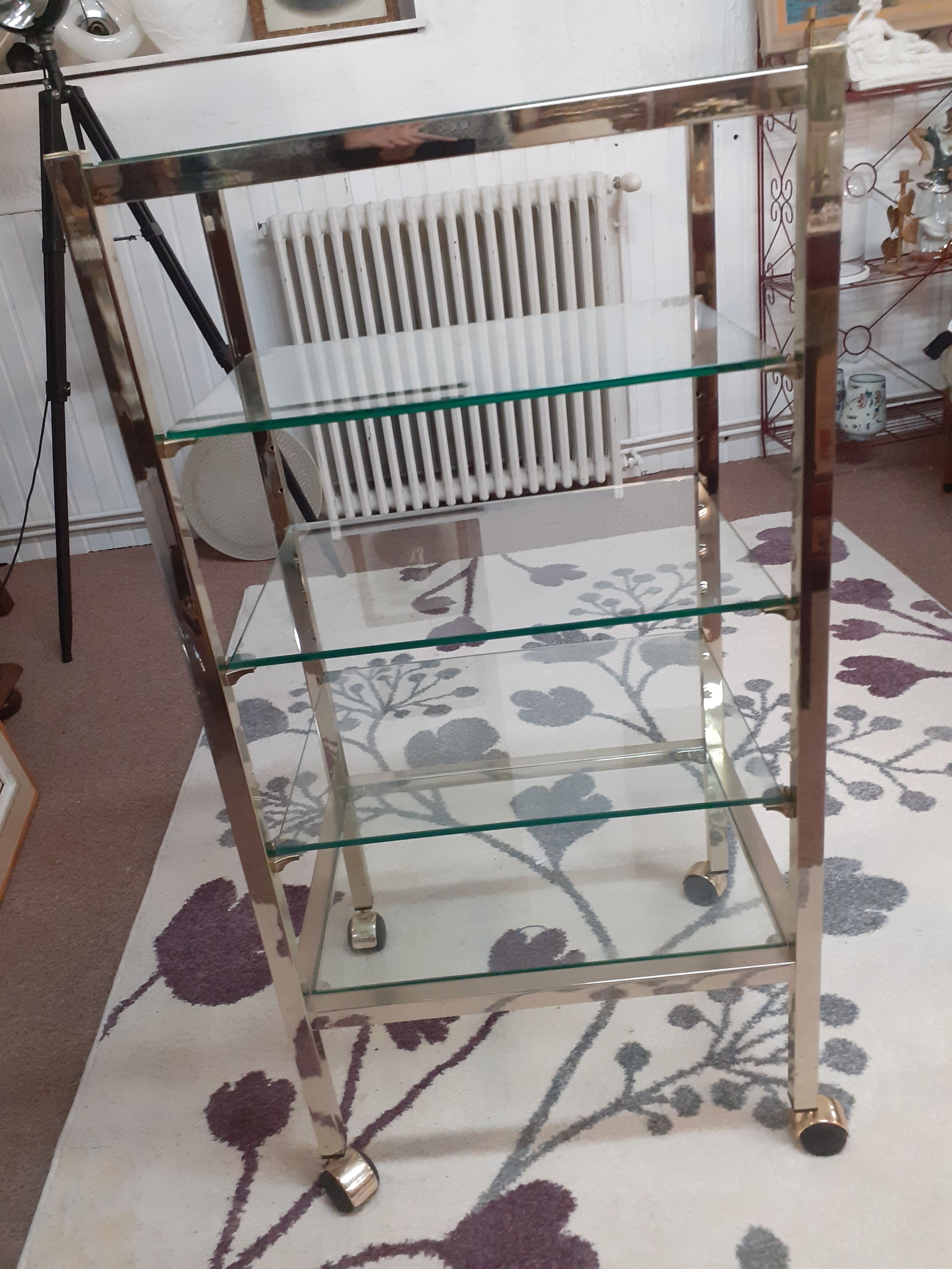 Glass and brass shelf on wheels