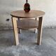 Art Deco round oak side table in light weathered oak with lower shelf, geometric three-leg design
