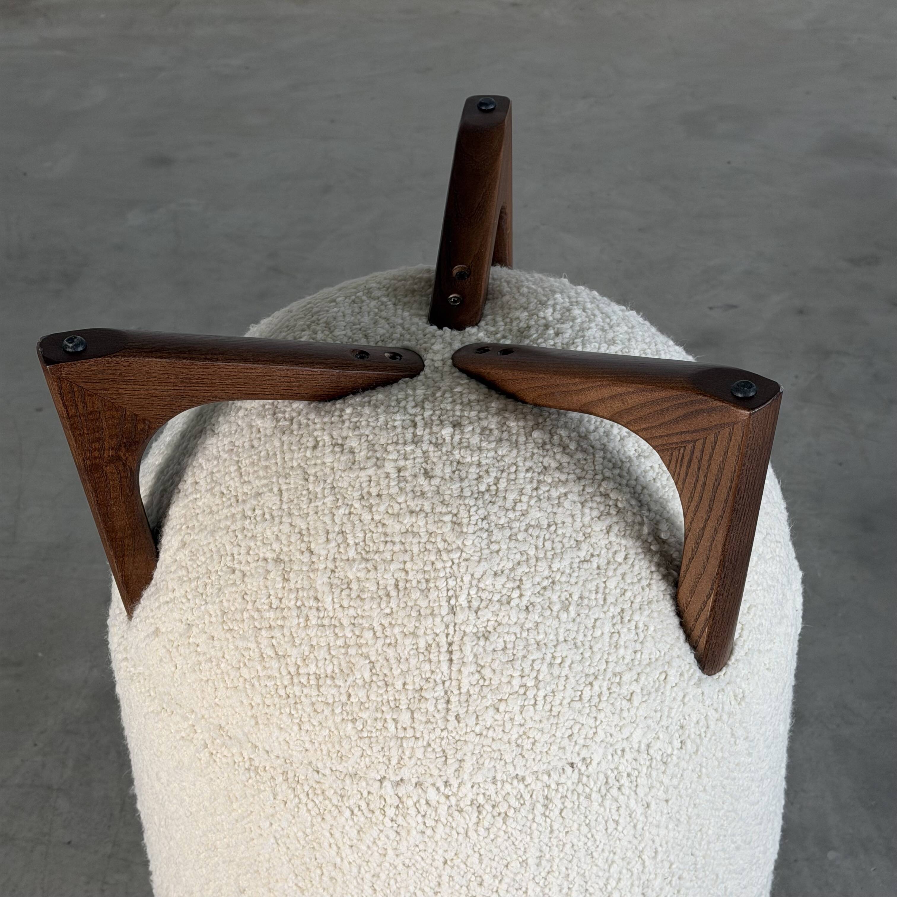 TOTEMO stools by FORME with ivory Dedar bouclé upholstery and walnut legs.
