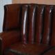 Victorian leather canapé and armchair, barrel back, circa 1860, restored.
