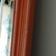Beveled glass wall mirror in solid wood frame