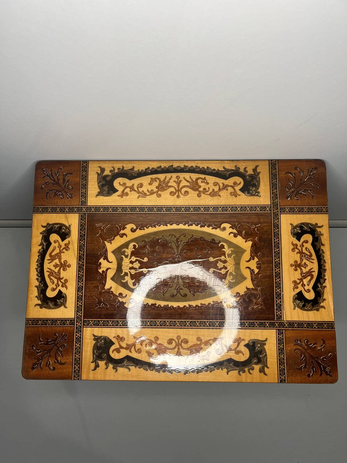 Small antique Italian inlaid table with Swiss music box.