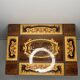 Small antique Italian inlaid table with Swiss music box.