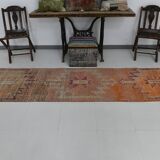2x12 shades of pale orange vintage runner rug