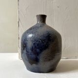 Glazed ceramic vase with a narrow neck and signed, unique piece.