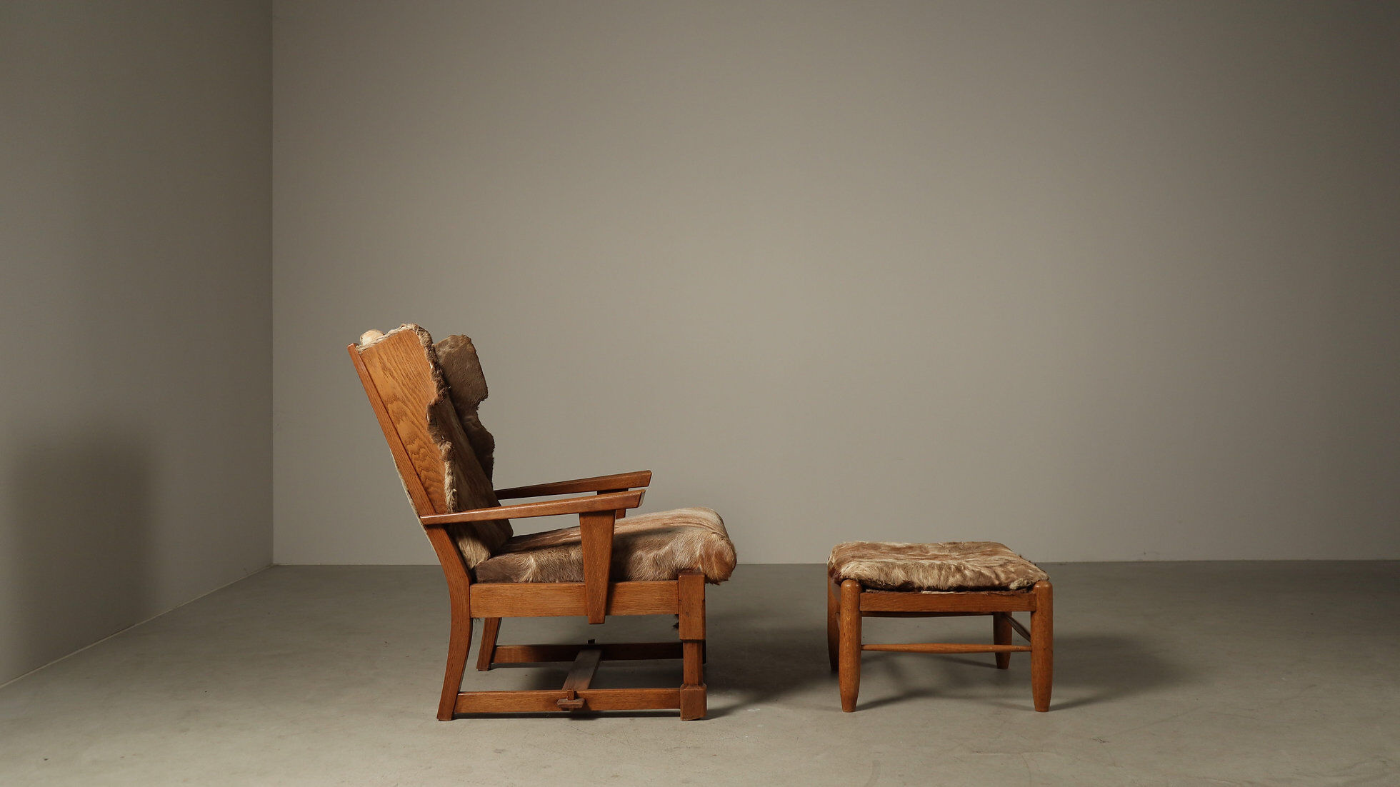 Brutalist oak lounge chair and ottoman in original goat hide, 1960s