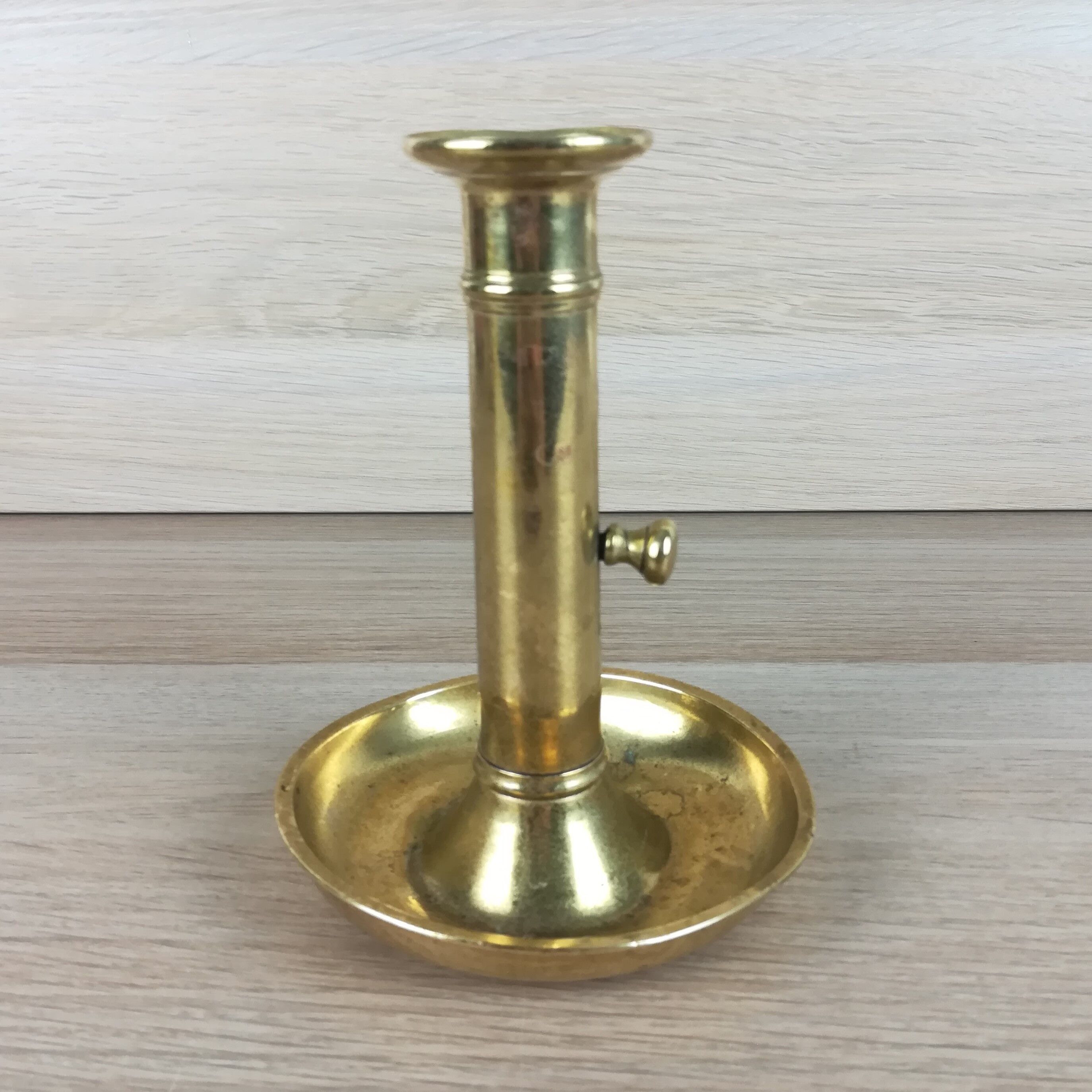 Brass pusher candle holder