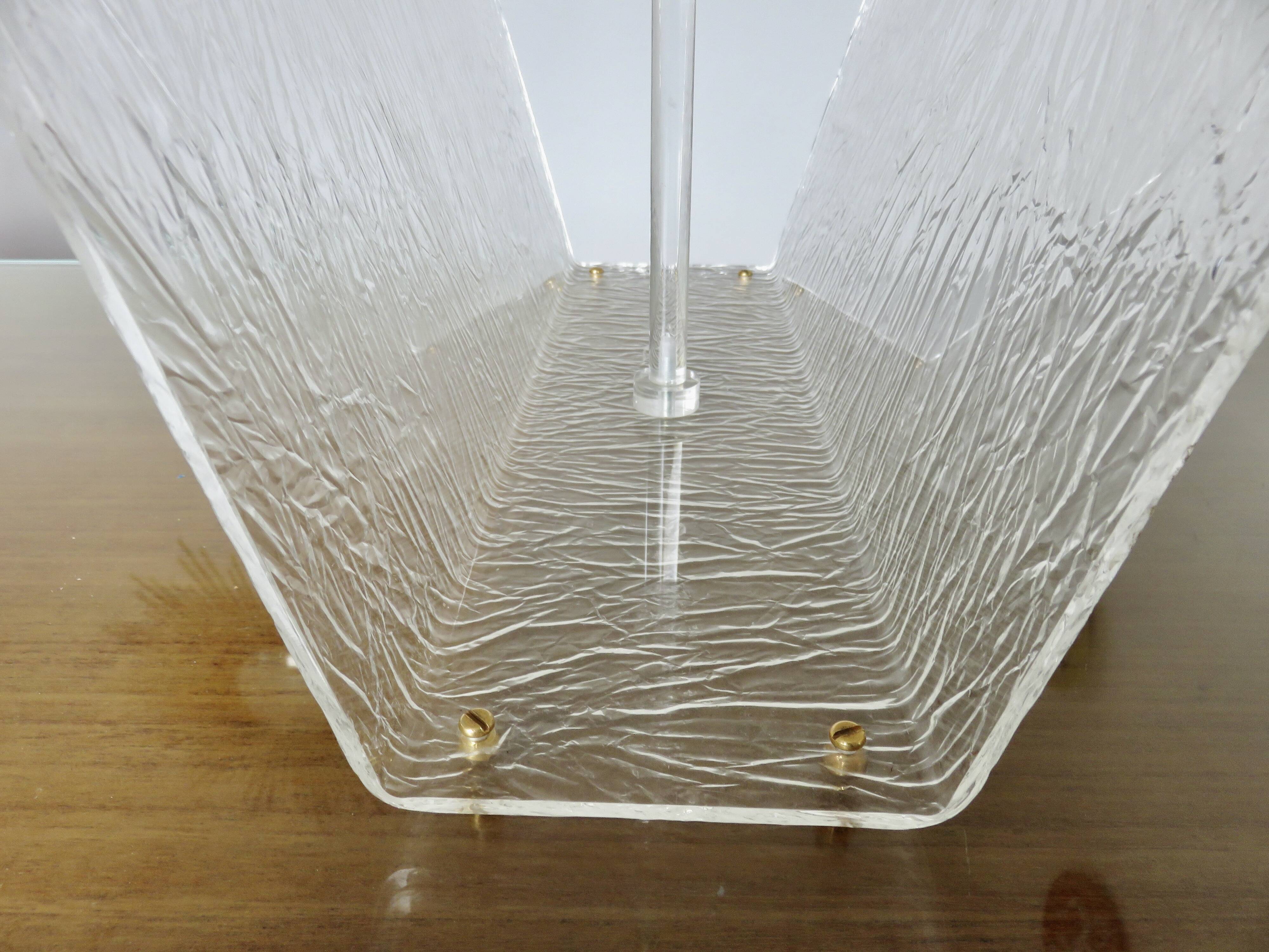 "Roche Bobois" magazine rack in lucite, plexiglass, altuglas and brass, 1970