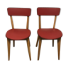 Deux chaises vintages pied compas bois claire et skaï rouge