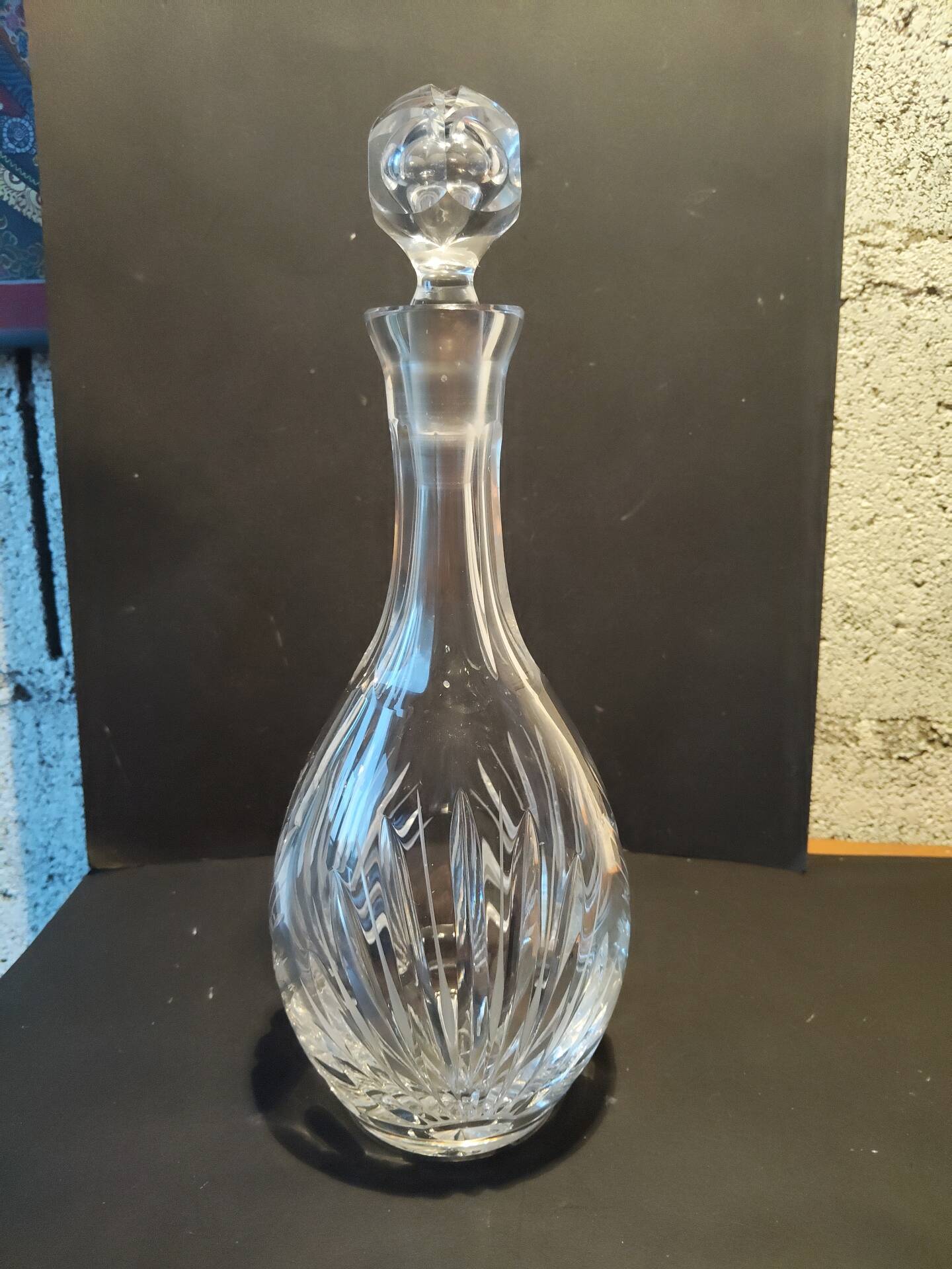 Vintage cut crystal carafe with floral stopper.