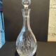 Vintage cut crystal carafe with floral stopper.