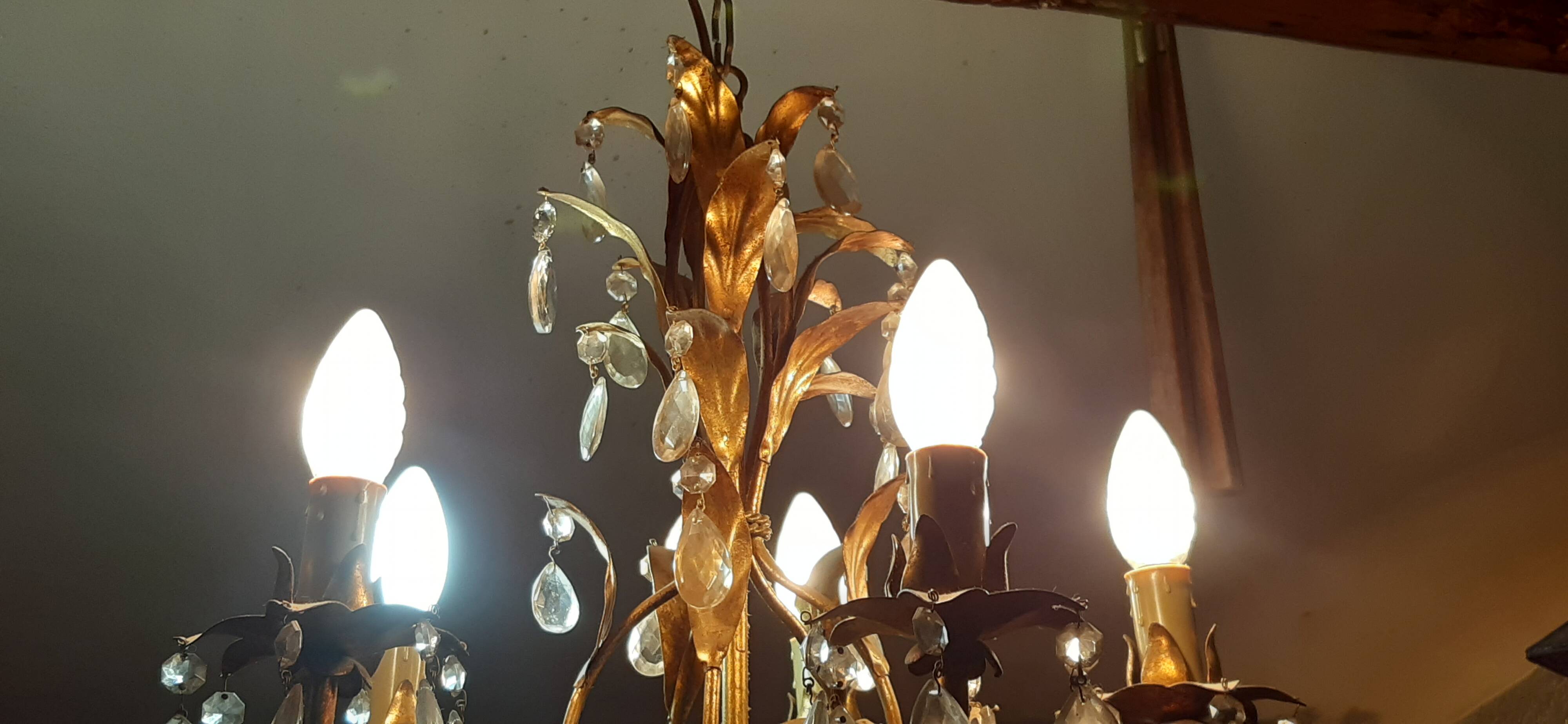 Very pretty chandelier with tassels and leaves in gold sheet metal.