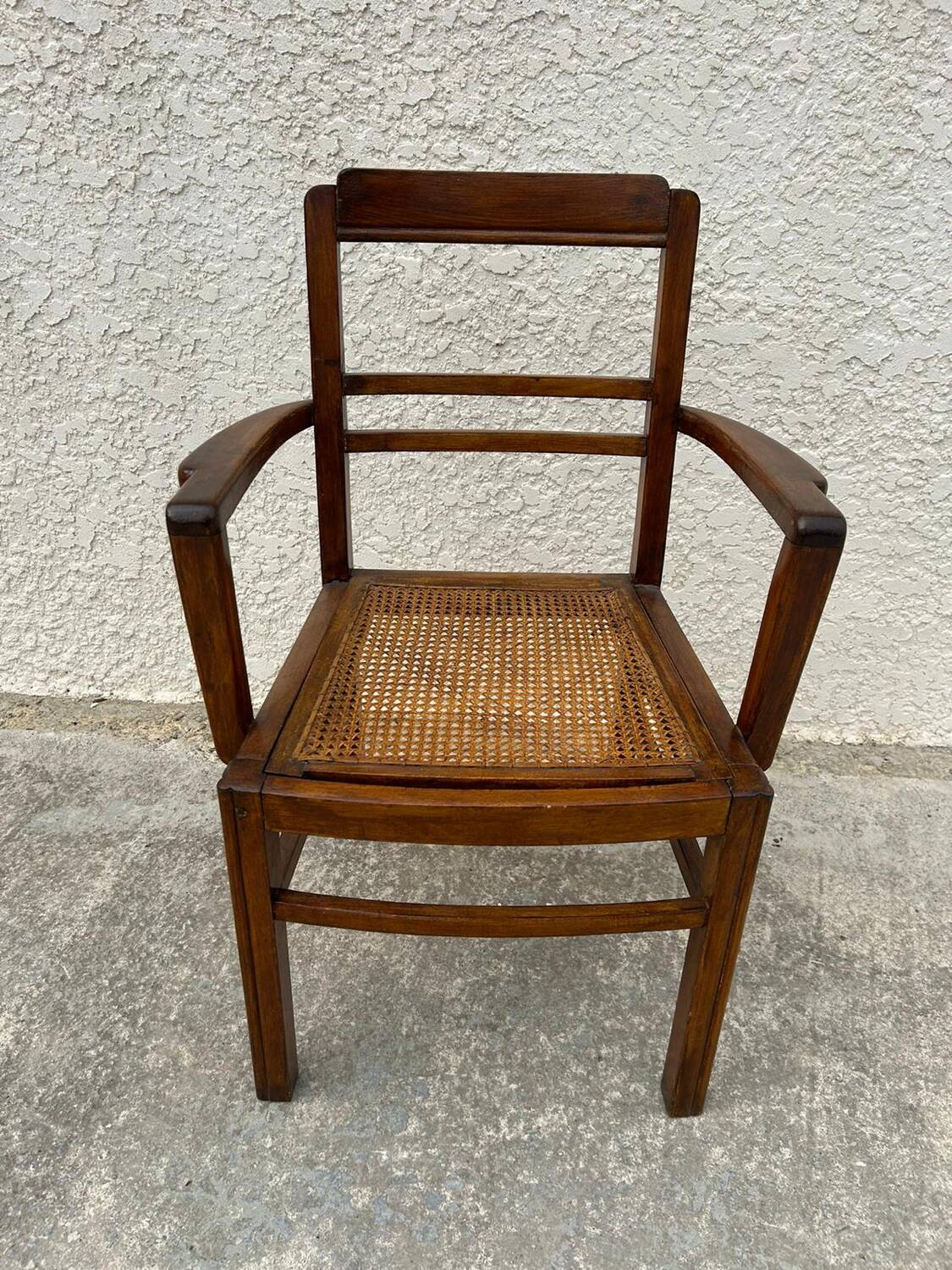 Cane armchair with armrests