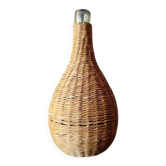 Old bottle dressed in wicker.