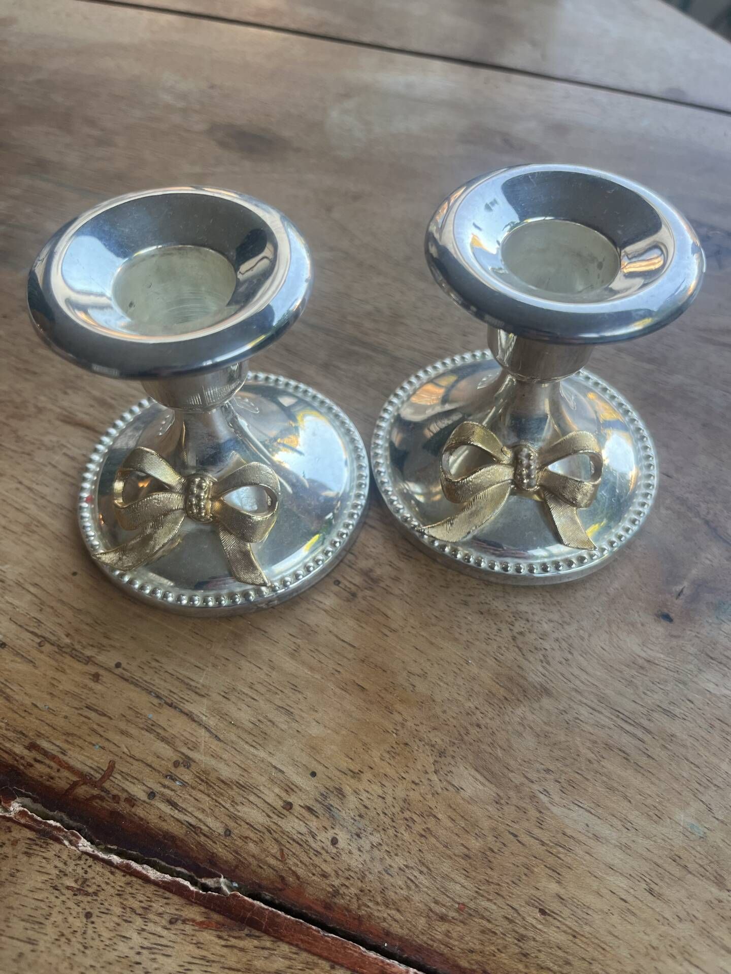 2 silver-plated candlesticks