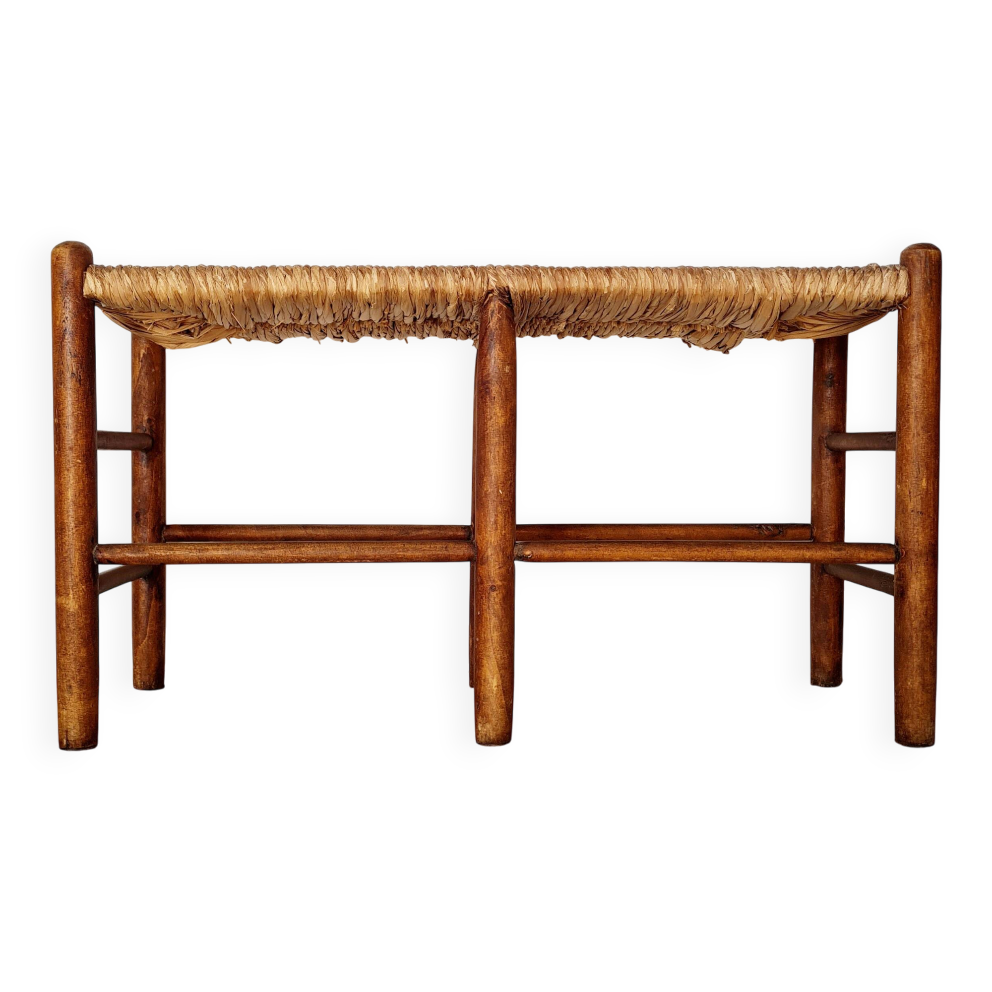 Old wooden and straw bench