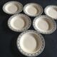 Set de 9 et 6 assiettes en faïence terre de fer de Salins début 20e décor gris vert