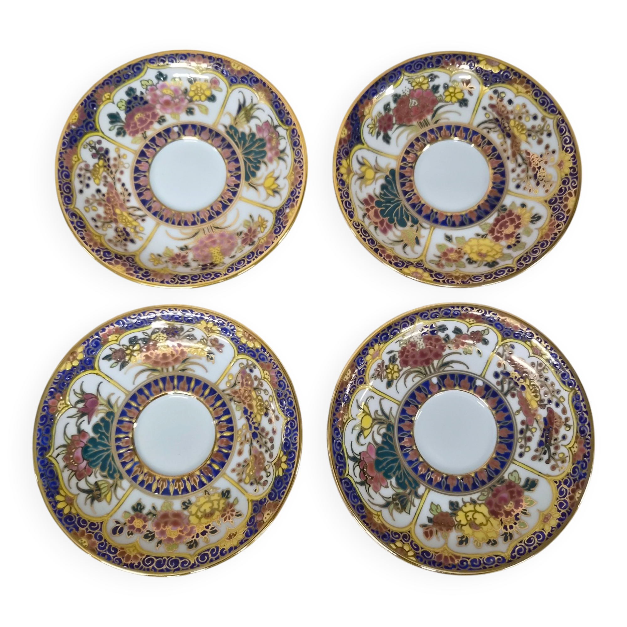 Set of 4 hand-painted saucers from Thailand – Polychrome floral decoration and gilding.