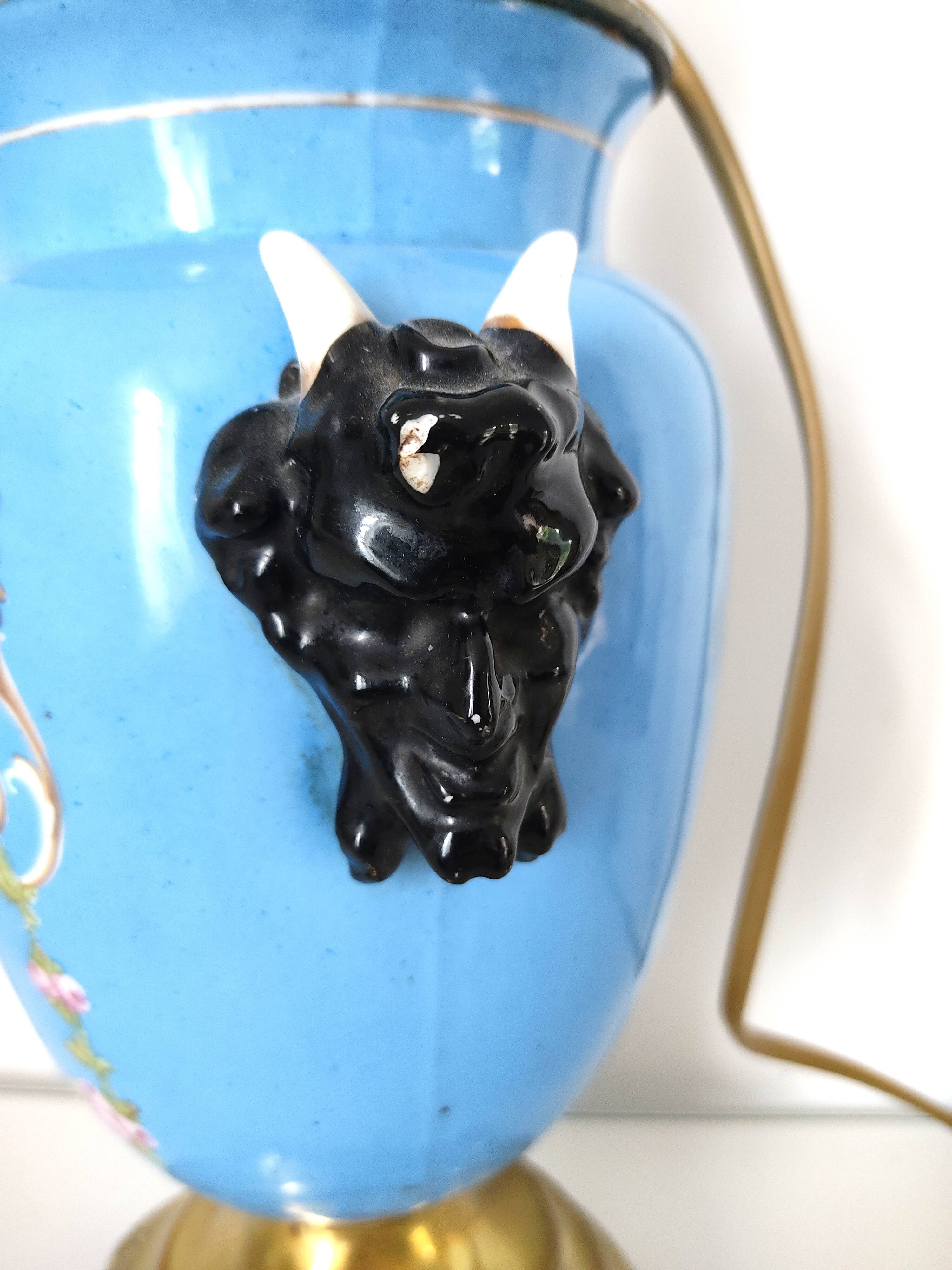 Lamp foot blue vase heads of fauna
