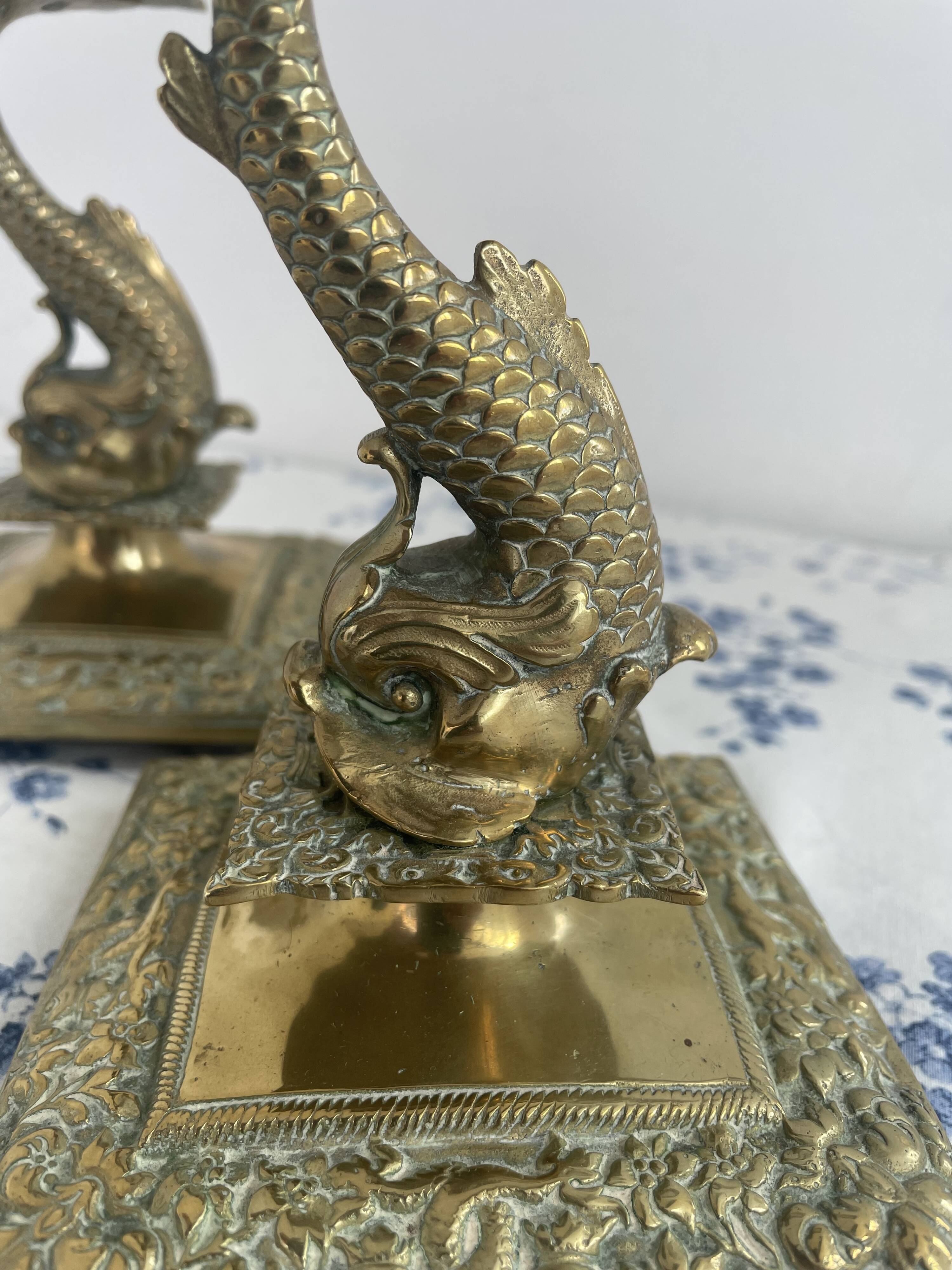 Pair of brass dolphin candlesticks, late 19th century, Napoleonic period