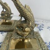 Pair of brass dolphin candlesticks, late 19th century, Napoleonic period